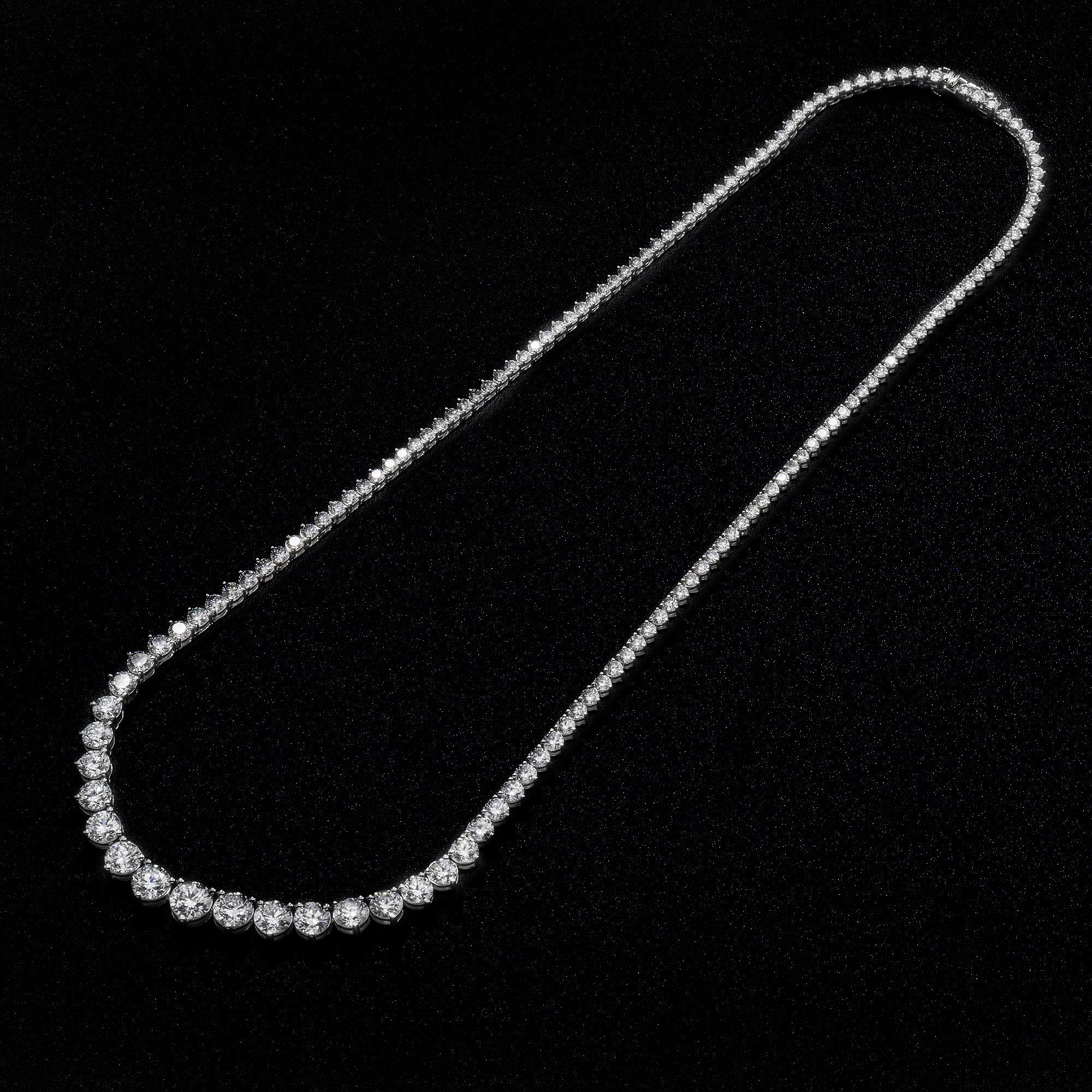 14K white gold graduated tennis necklace featuring natural diamonds. luxury diamond necklace.