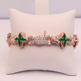 14K ROSE GOLD GREEN SAPPHIRE CROSS 12.33 CTW. DIAMOND BRACELET