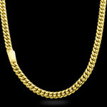 Gold chain necklace on a black background