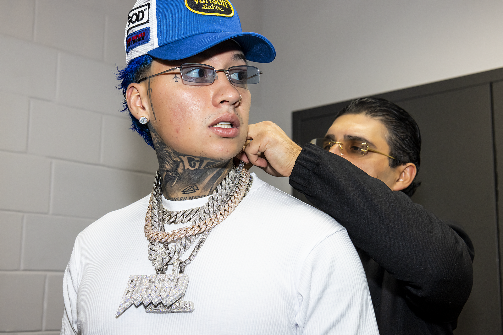 image of blessd the music artist with el russo & co on a performance show.