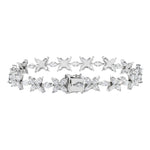 Back side of White Gold bracelet with butterfly-shaped diamonds on a black background