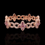 Complete view of rose gold bracelet with star-shaped charms on a Black background
