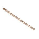 Long view Gold chain bracelet with diamond accents on a white background