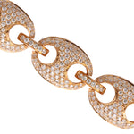 Zoomed Gold chain bracelet with diamond accents on a white background
