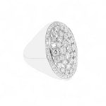 Silver ring with a diamond-encrusted band on a white background
