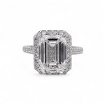 Natural Diamond ring with emerald-cut center stone on a white background