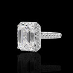 Natural Diamond ring with a rectangular center stone on a black background