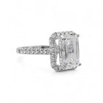 Side of Diamond ring with emerald-cut center Diamond on a white background