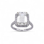 Natural Diamond ring with emerald-cut center Diamond and halo on a white background