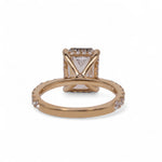 Back side of Rose gold ring with a diamond on a white background