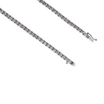 Close up of white gold bracelet with diamonds on a white background