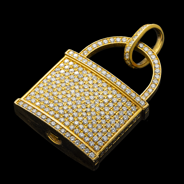Gold padlock-shaped pendant with diamond accents on a black background