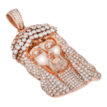 Left side view of Rose gold diamond Jesus face pendant laid on a White background