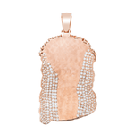 Back of Rose gold diamond Jesus face pendant laid on a White background