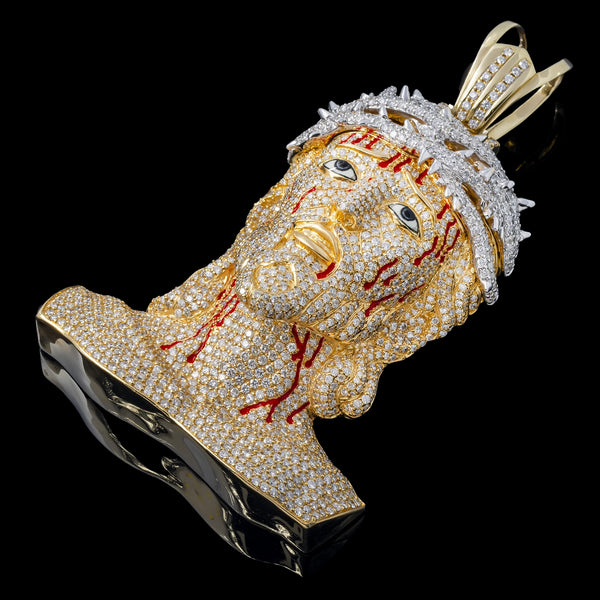 Right side view of Jesus Head Pendant a figure with gold and diamond details on a black background
