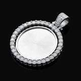 Silver pendant with clear gemstones on a black background