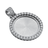 Silver pendant with clear diamonds on a white background