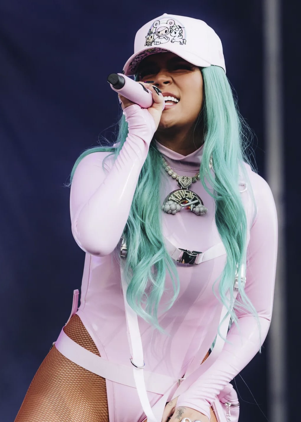 Karol G on stage wearing El Russo & Co diamond chain