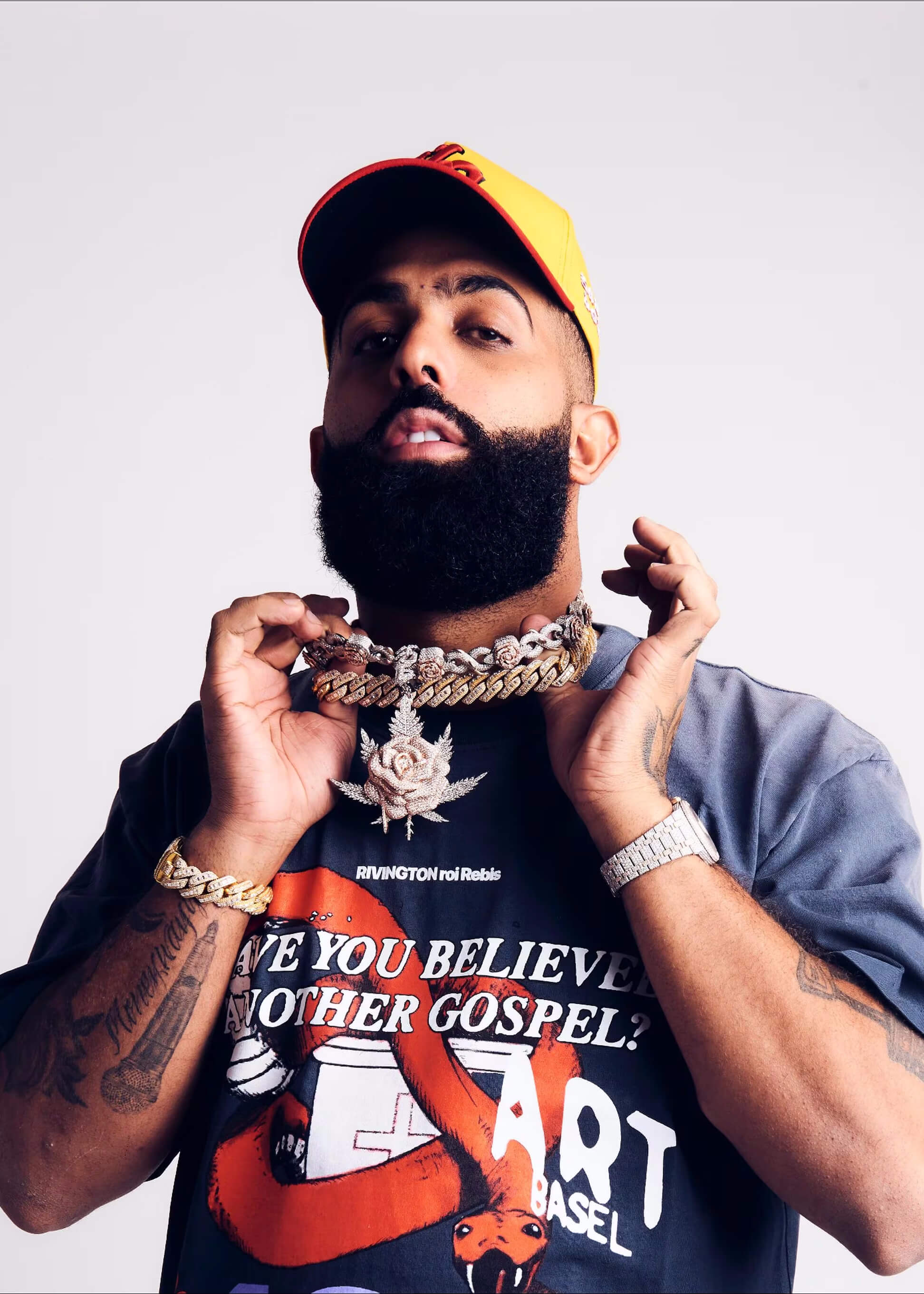 Eladio Carrion wearing an El Russo & Co Custom made Diamond flower pendant