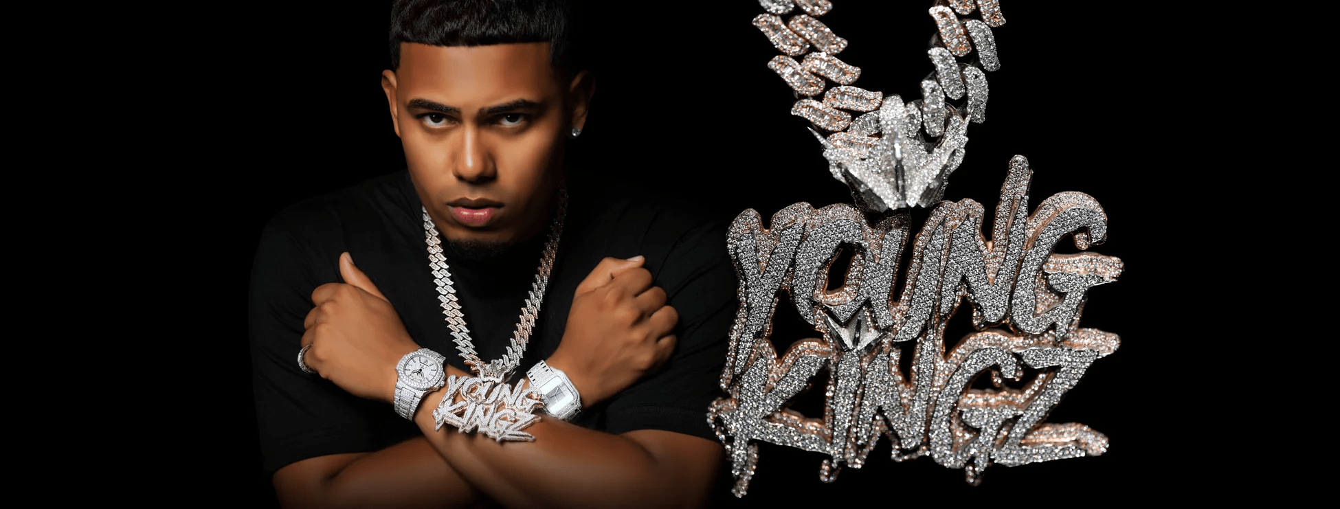 myke towers wearing a el russo & co create custom chain saying  " young kingz "